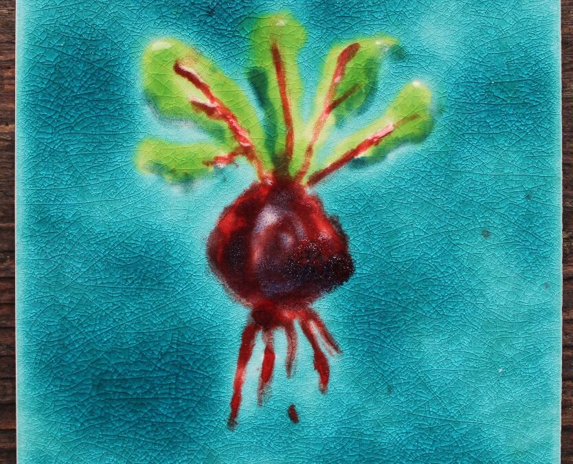 Handmade bespoke beetroot ceramic tile with jade crackle glaze background