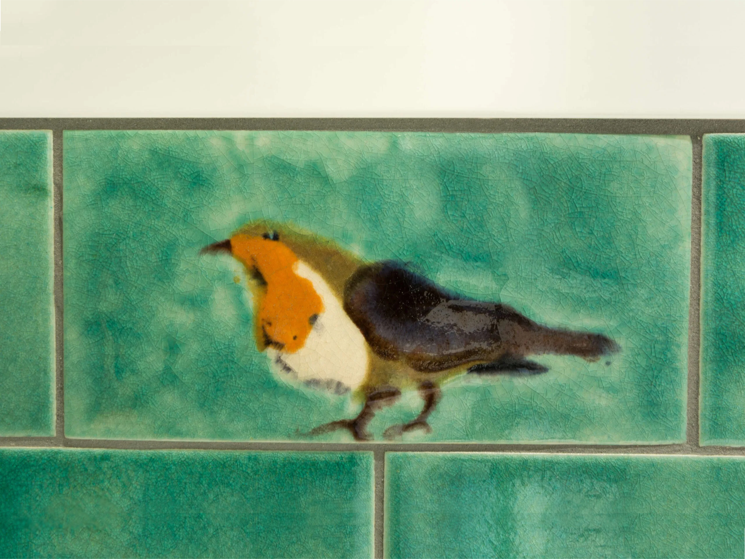 Robin tile with plain Celadon tiles